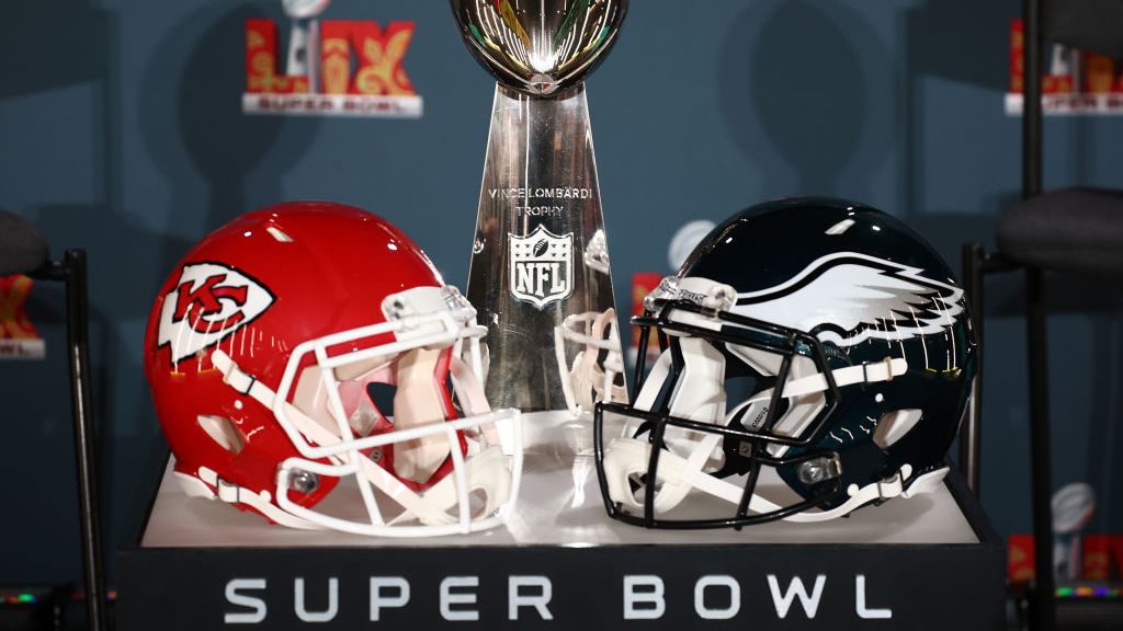 Super Bowl helmets next to each other with the trophy and the words Super Bowl written below