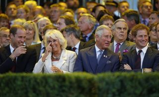 Prince William, Duke of Cambridge, Camilla, Duchess of Cornwall, Prince Charles, Prince of Wales and Prince Harry laugh during the opening ceremony of the Invictus Games at the Queen Elizabeth Park on September 10, 2014 in east London, England