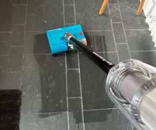 Cleaning slate tiles with the Dyson V15s Detect Submarine