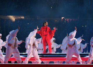 Rihanna at the Super Bowl in the red Loewe jumpsuit.