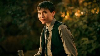 Elliot Page as Victor smiling in a press image from Season of The Umbrella Academy.