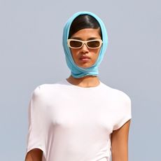 Model wearing turquoise on the runway at the Jacquemus fall/winter 2024 show. 