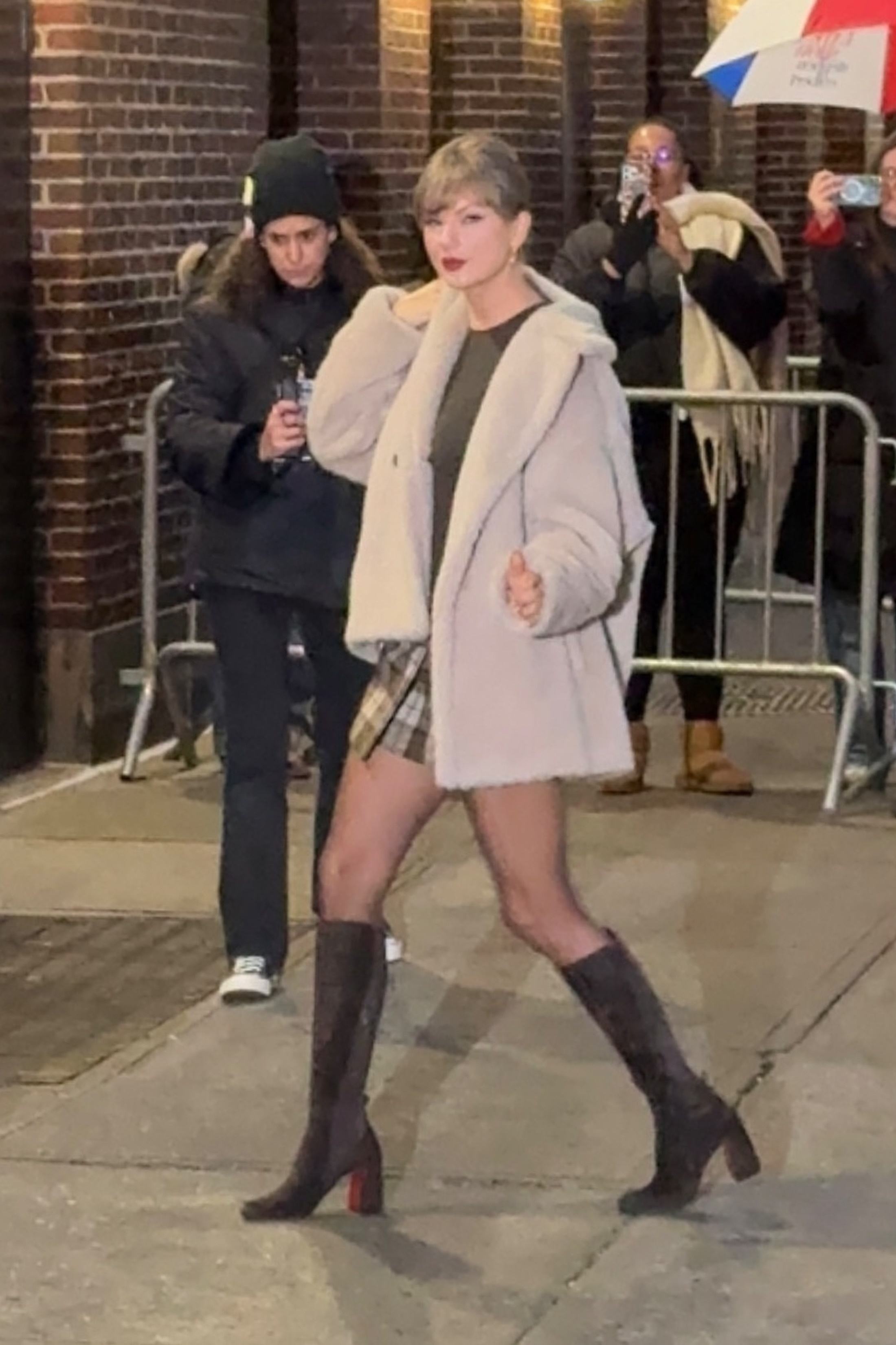 Taylor Swift arriving at the Late Show with Stephen Colbert in a faux fur coat