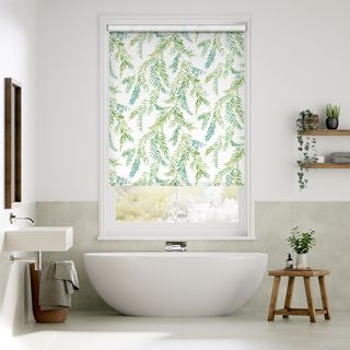Green leaf pattern blinds in white bathroom