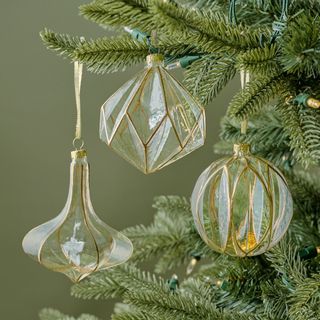 Vintage Glass and Gold Ornaments, Set of 6 against a green background.