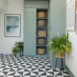 hallway with black and white flooring