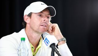 Rory McIlroy talks into a microphone