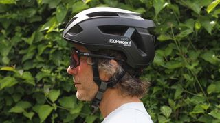 side on shot of the 100% Altis Gravel helmet being worn