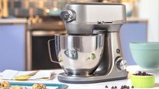 GE Stand Mixer on a countertop with cookies in front of it