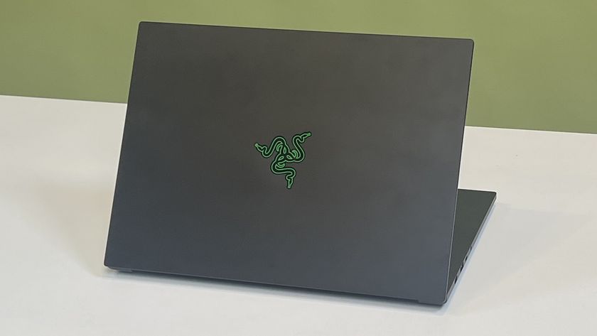 A Razer Blade 14 (2025) on a desk with its lid facing the viewer