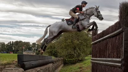 Andrew Nicholson and Avebury jumping the large open ditch the Cottesmore Leap at Burghley: How to solve your horse’s fear of ditches