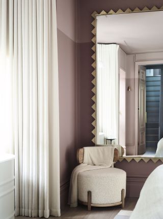 pink bedroom with wavy mirror