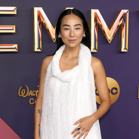 Greta Lee attends the 76th Primetime Emmy Awards at Peacock Theater on September 15, 2024 in Los Angeles, California wearing a white loewe gown