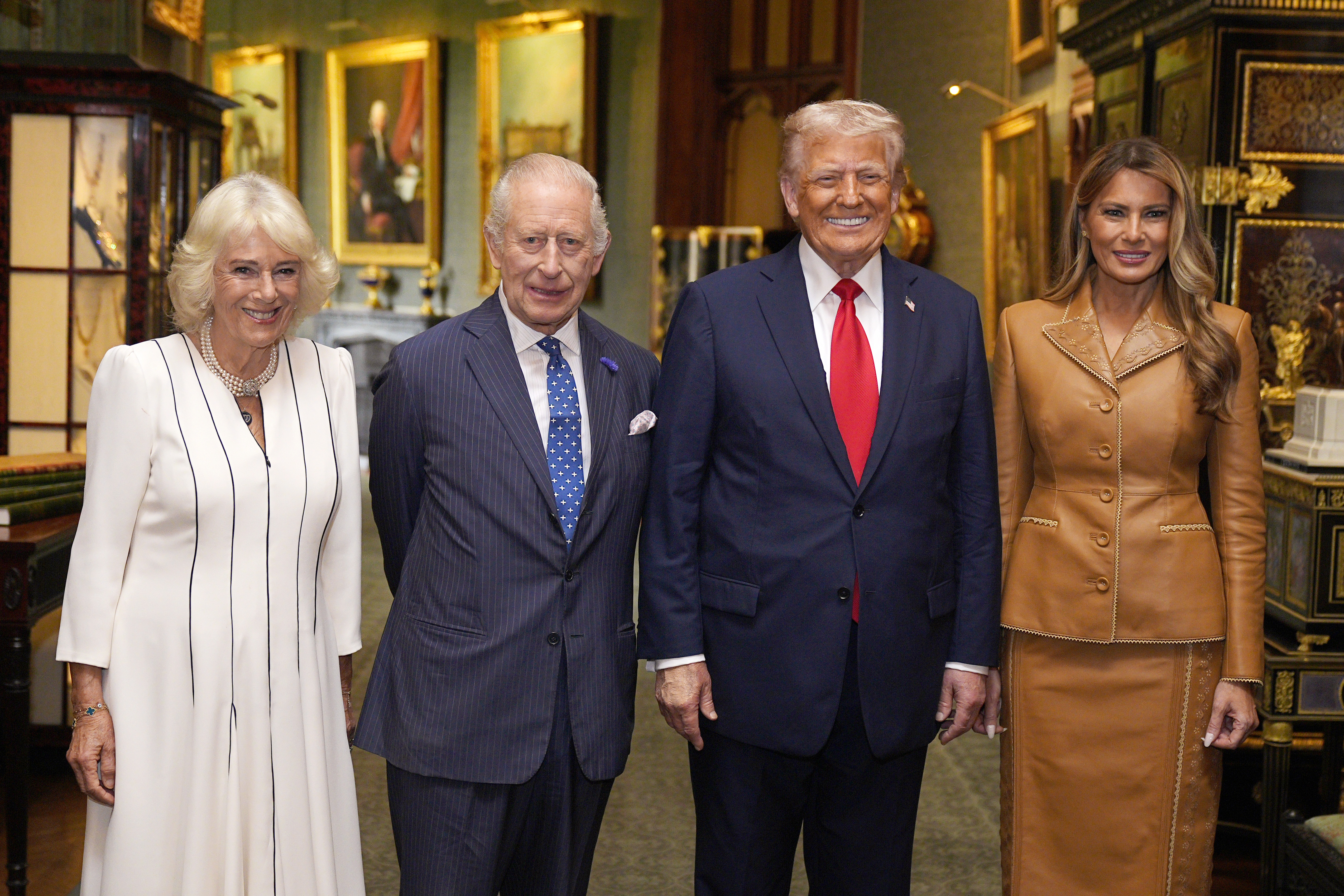 Queen Camilla, King Charles, Donald Trump, Melania Trump standing in a row and smiling
