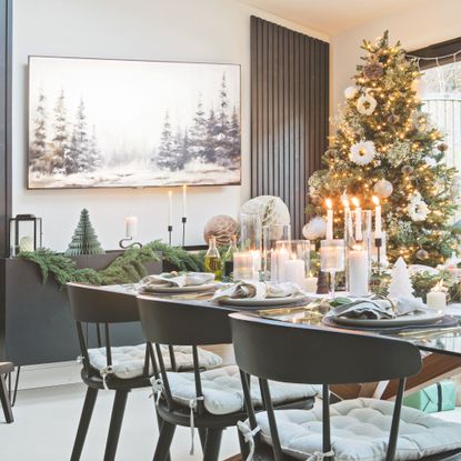 Decorated Christmas tree in dining room with tablescaping