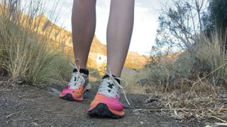 Runner's feet wearing Merrell Long Sky 2 Matryx women’s trail running shoes