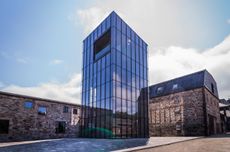 Exterior of the Glenmorangie whisky distillery building with new experimental distillery, the Lighthouse