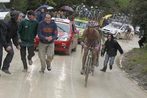Race leader Vincenzo Nibali leads Ivan Basso (both Liquigas-Doimo) on muddy roads.