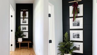 Dark feature wall in a hallway with art