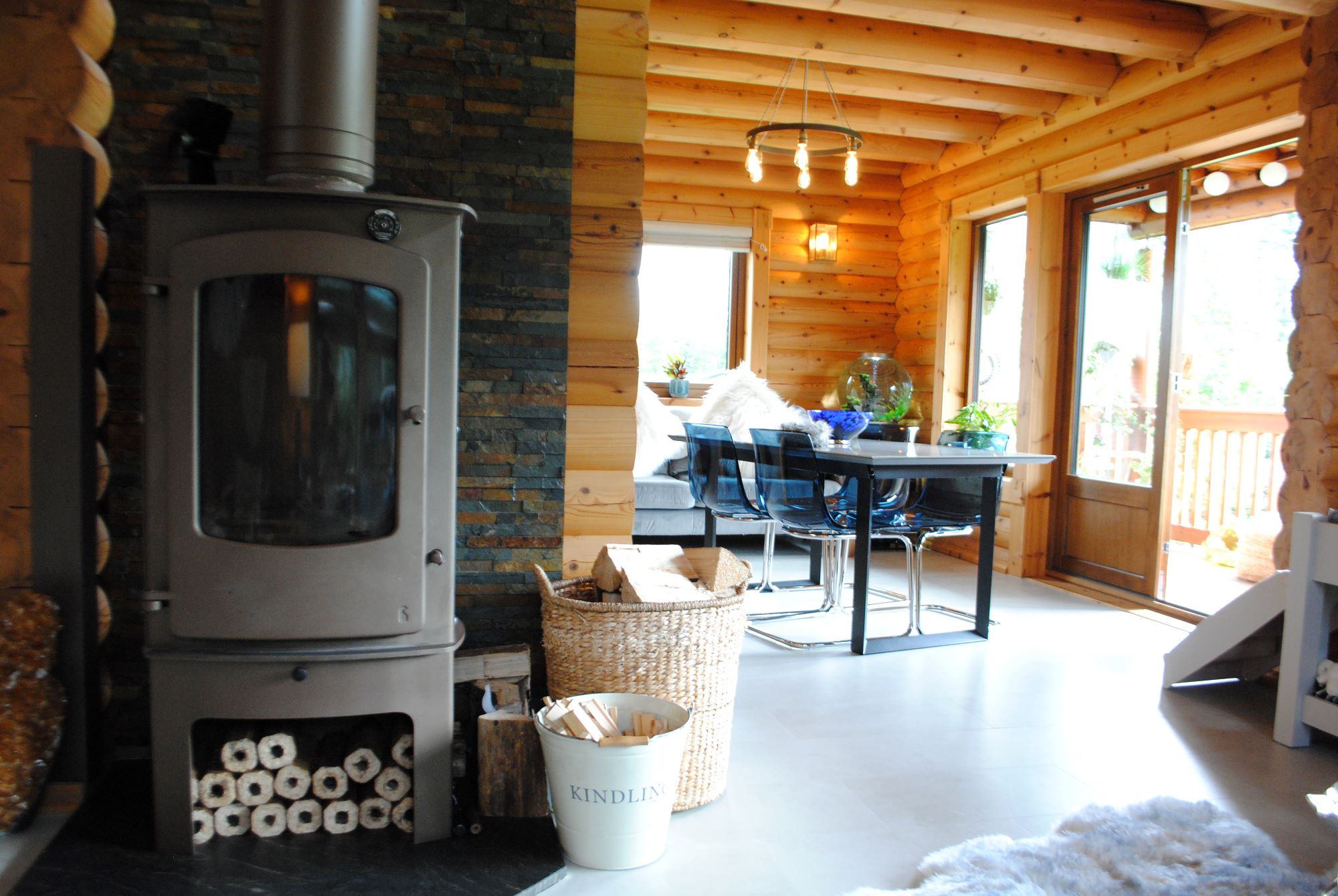 The wood burner sits in the dining area which is an extension of the kitchen