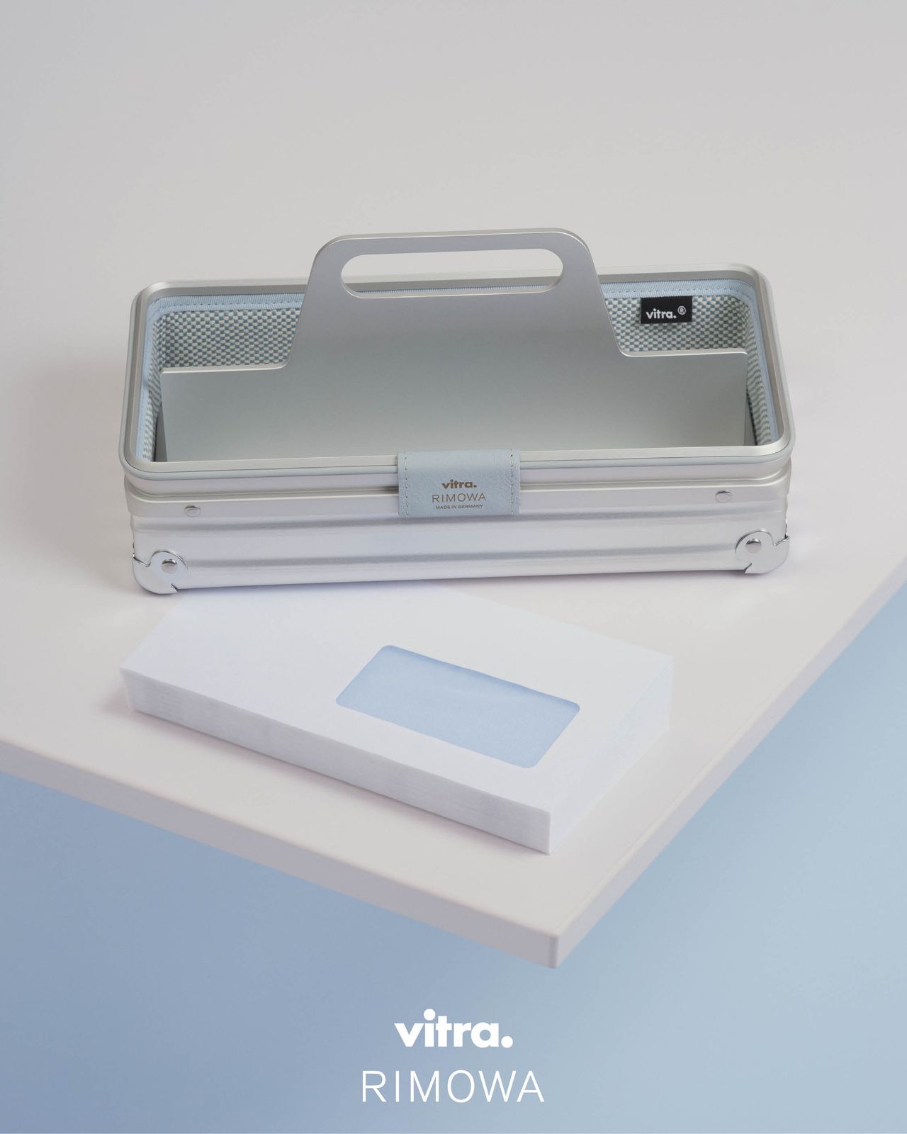 A sleek aluminum toolbox with ice blue ;eather accents
