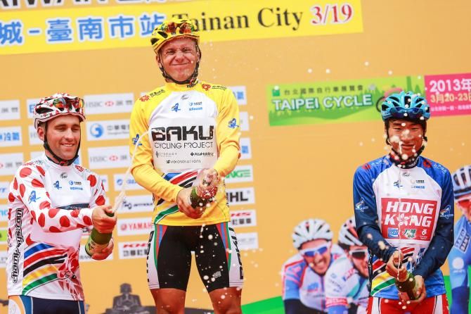 Jersey holders Nathan Earle (mountains leader), Kirill Pzdnyakov (race leader) and Choi Ki Ho (best Asian rider)