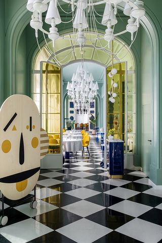 Harlequin themed chequered marble floors at the Jaime Hayon-redesigned La Terraza del Casino restaurant, Madrid, Spain