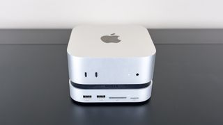 The Ugreen Mac Mini M4 Dock & Stand installed underneath a Mac mini M4 mini PC on a desk