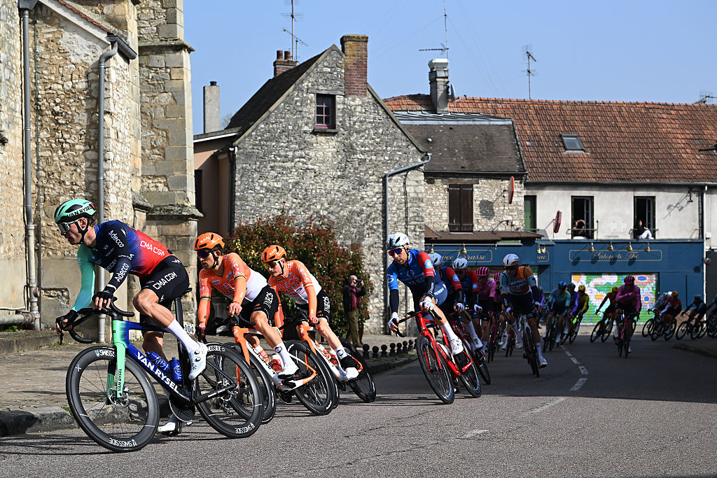 CARRIERES-SOUS-POISSY, FRANCE - MARCH 08: Oscar Chamberlain of Australia and Team Decathlon CMA CGM and a general view of the peloton competing during the 84th Paris-Nice 2026, Stage 1 a 170.9km stage from Acheres to Carrieres-sous-Poissy / #UCIWT / on March 08, 2026 in Carrieres-sous-Poissy, France. (Photo by Szymon Gruchalski/Getty Images)
