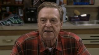 Dan Conner sitting at kitchen table talking to Darlene and Ben in The Conners Season 6