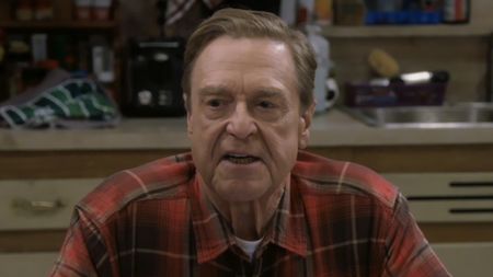 Dan Conner sitting at kitchen table talking to Darlene and Ben in The Conners Season 6