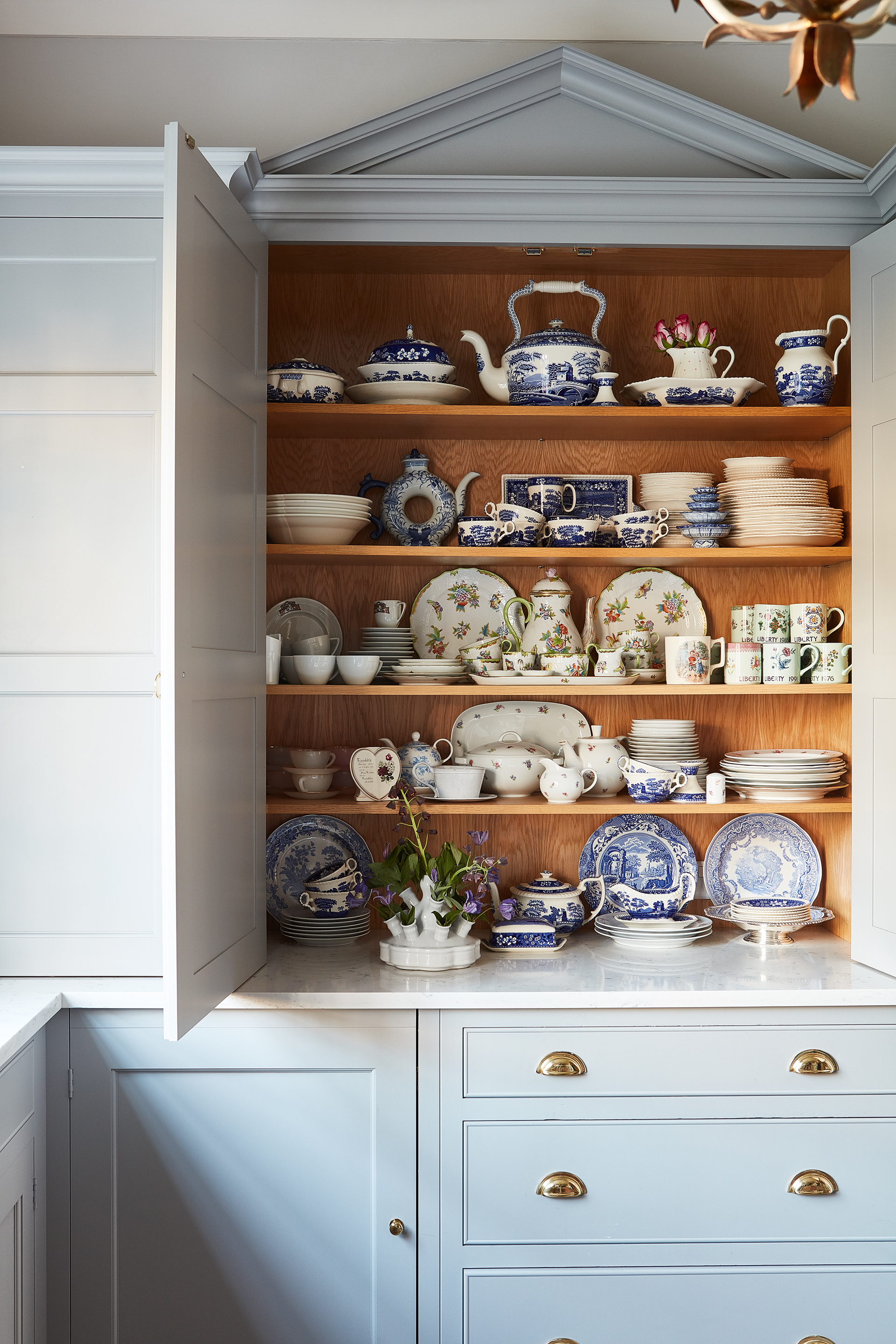 blue kitchen cupboard with Farmhouse kitchen wall decor and rustic wall decor ideas in the form of plates and cups