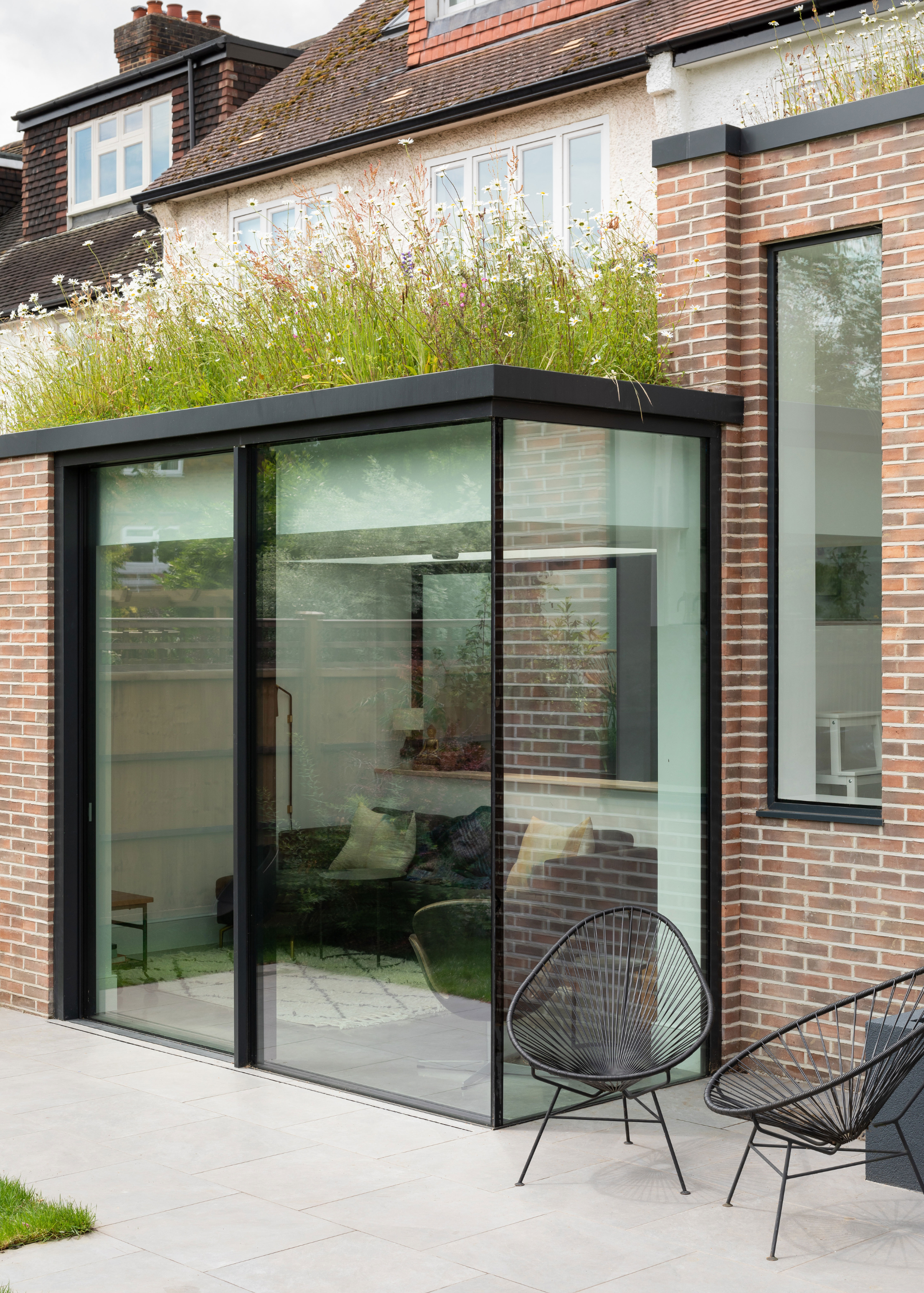 an extension with a wildflower planted roof in a home.