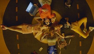 Assassination Nation the girls lay on the gym floor in a circle