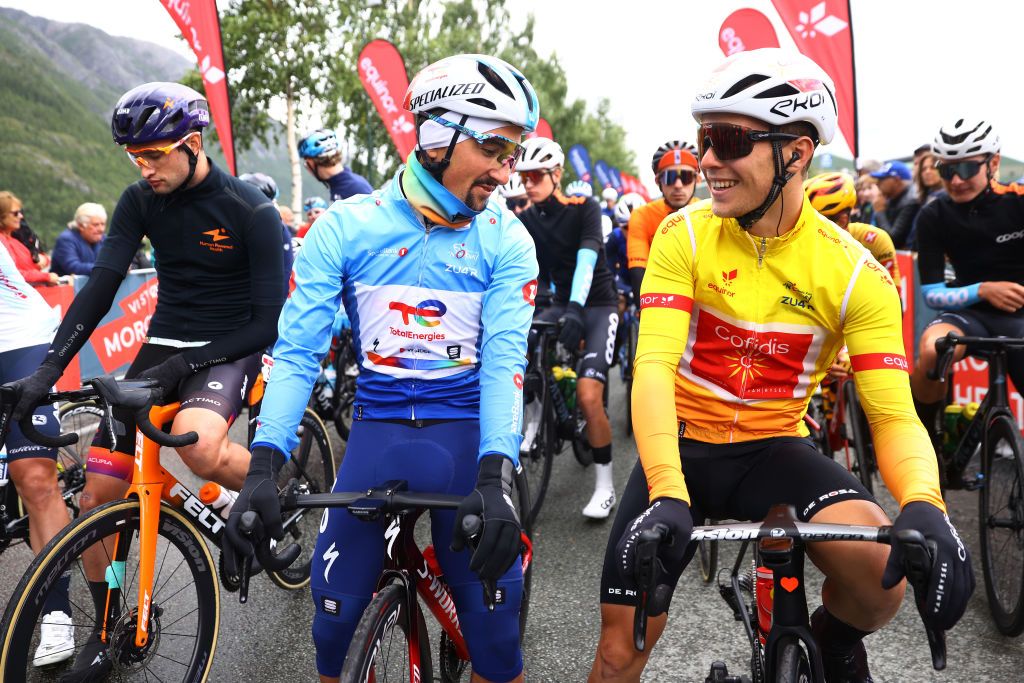 BRONNOYSUND NORWAY AUGUST 12 LR Stephen Bassett of United States and Team Human Powered Health Polka Dot Mountain Jersey Mathieu Burgaudeau of France and Team Total Energies Blue Points Jersey and Axel Zingle of France and Team Cofidis Yellow Leader Jersey prior to the 9th Arctic Race Of Norway 2022 Stage 2 a 1543km stage from Mosjen to Brnnysund ArcticRace on August 12 2022 in Bronnoysund Norway Photo by Michael SteeleGetty Images