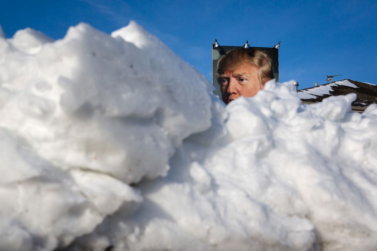 A Trump supporter&amp;#039;s sign is obscured by snow.