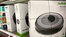 Robot vacuums on a shelf at a store