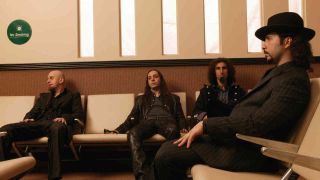 System Of A Down sitting on sofas backstage