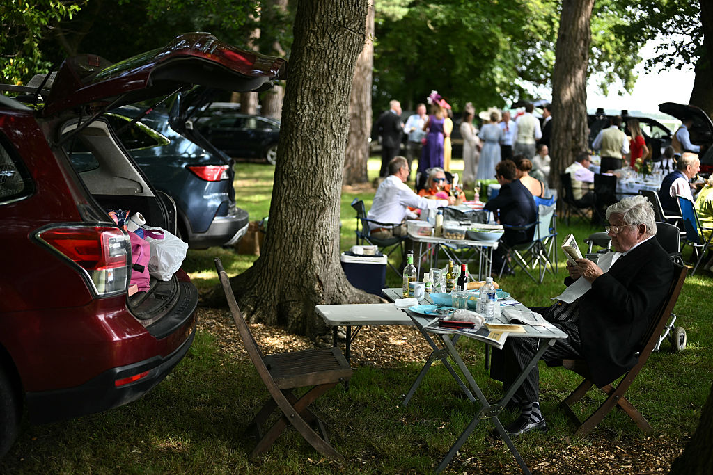 Racegoers picnic from the boots of their cars in Car Park One, ahead of racing on the first day of the Royal Ascot horse race meeting in Ascot, west of London, on June 17, 2025.