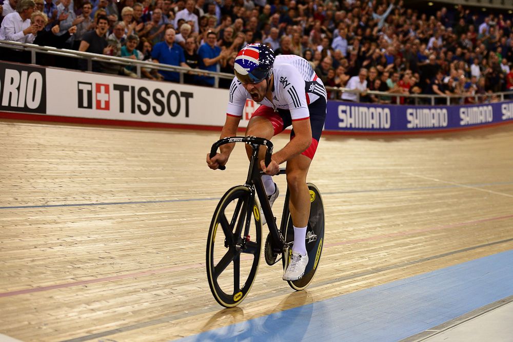 Jonathan Dibben of Great Britain breaks clear on the final lap to win the final of the Mens Points Race