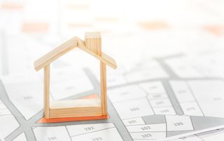 wooden house stood on plans on corner plot location