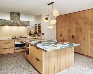 Modern kitchen with oak panels and marble surface