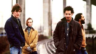 Soundgarden standing under an overpass in 1997