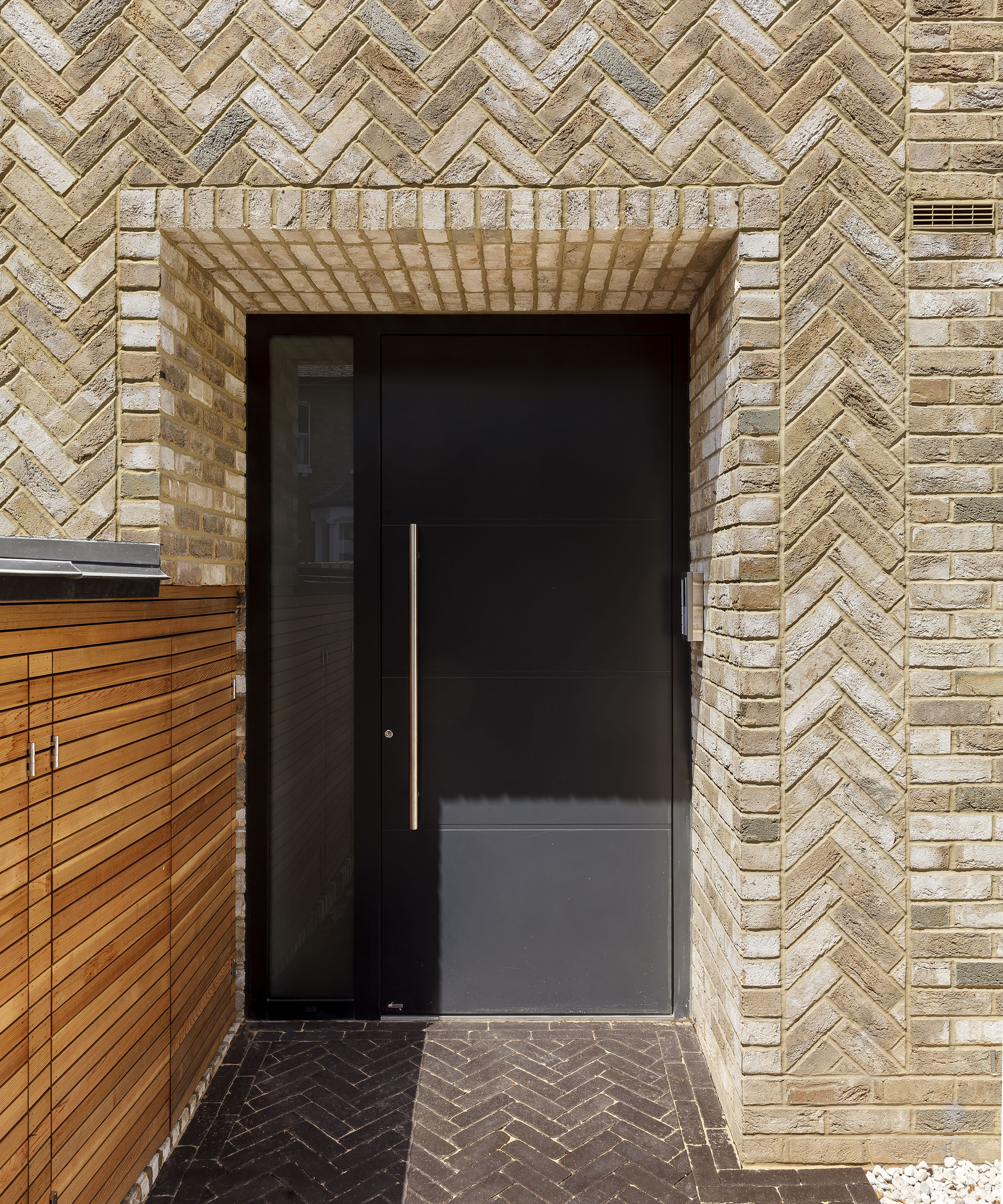 modern brick porch with modern front door