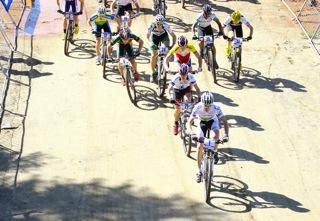 World champ Victor Koretsky leads the field off the startline in the junior cross country