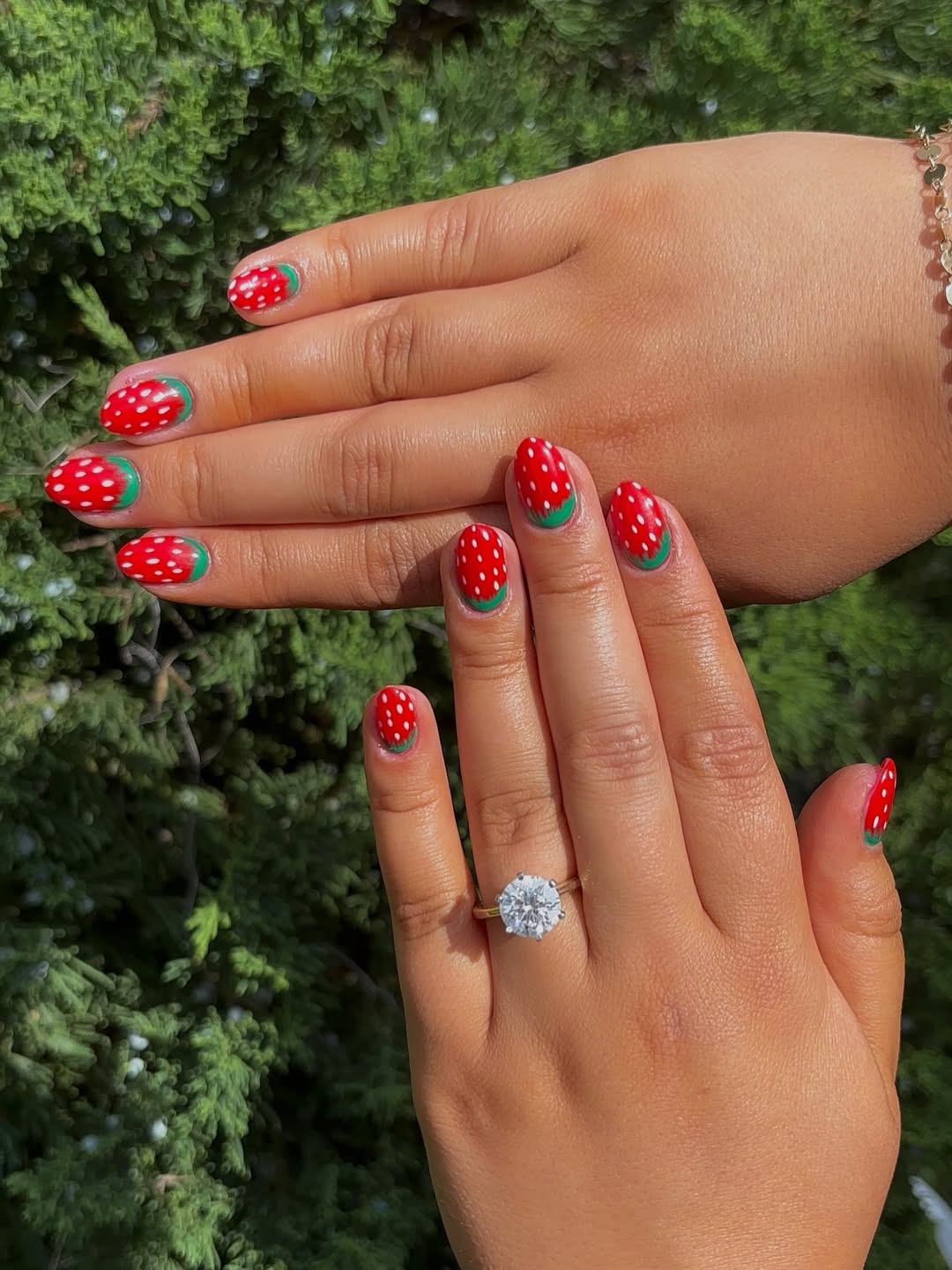 red nails with strawberry design