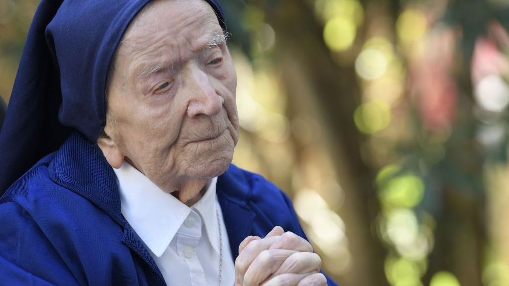 A nun clasping her hands in prayer. 