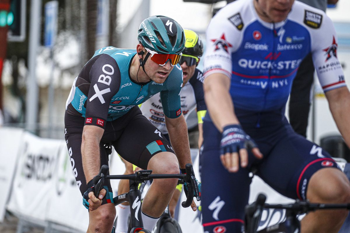 As Fabio Jakobsen celebrates stage 1 victory, Alexander Kristoff in the background remonstrates with Jordi Meeus