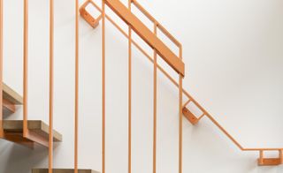 A painted steel and oak staircase