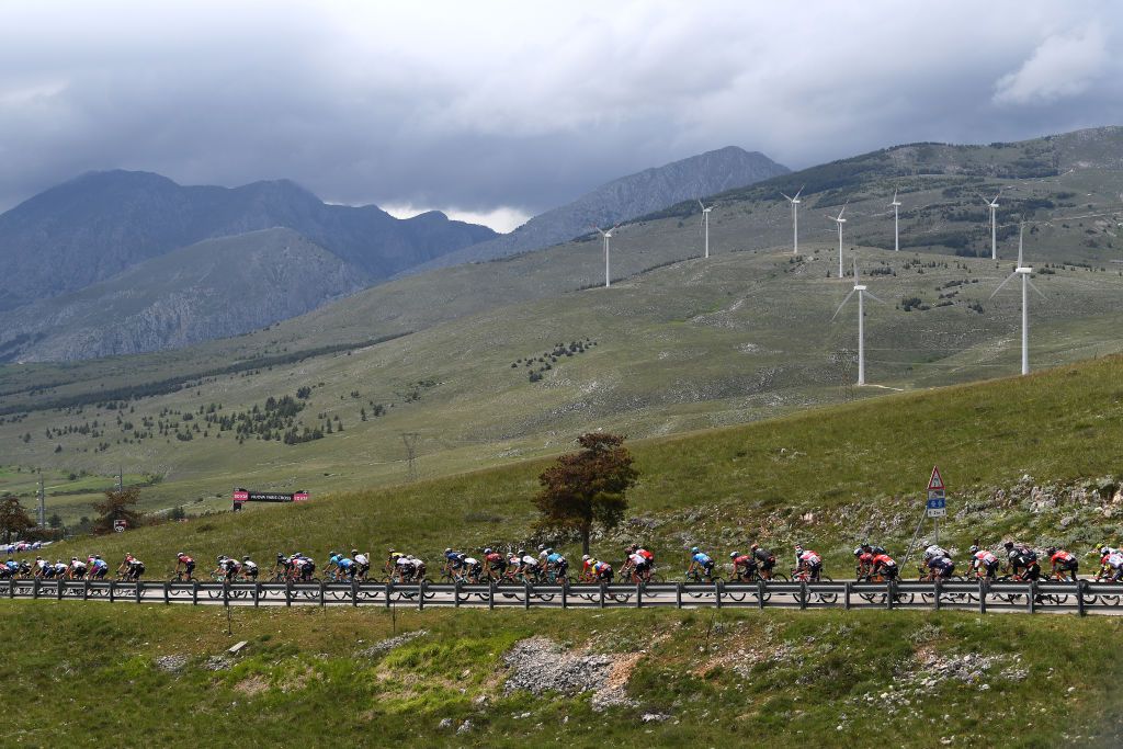 CAMPO FELICE ROCCA DI CAMBIO ITALY MAY 16 The Peloton passing through Nomi 179m mountain landscape during the 104th Giro dItalia 2021 Stage 9 a 158km stage from Castel di Sangro to Campo Felice Rocca di Cambio 1665m girodiitalia Giro UCIworldtour on May 16 2021 in Campo Felice Rocca di Cambio Italy Photo by Tim de WaeleGetty Images